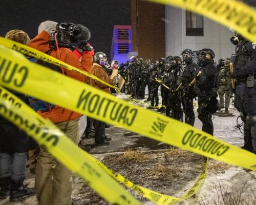 DHS Agents Put on Leave After Minneapolis Shooting, Trump Says He Will Slow Immigration Raids